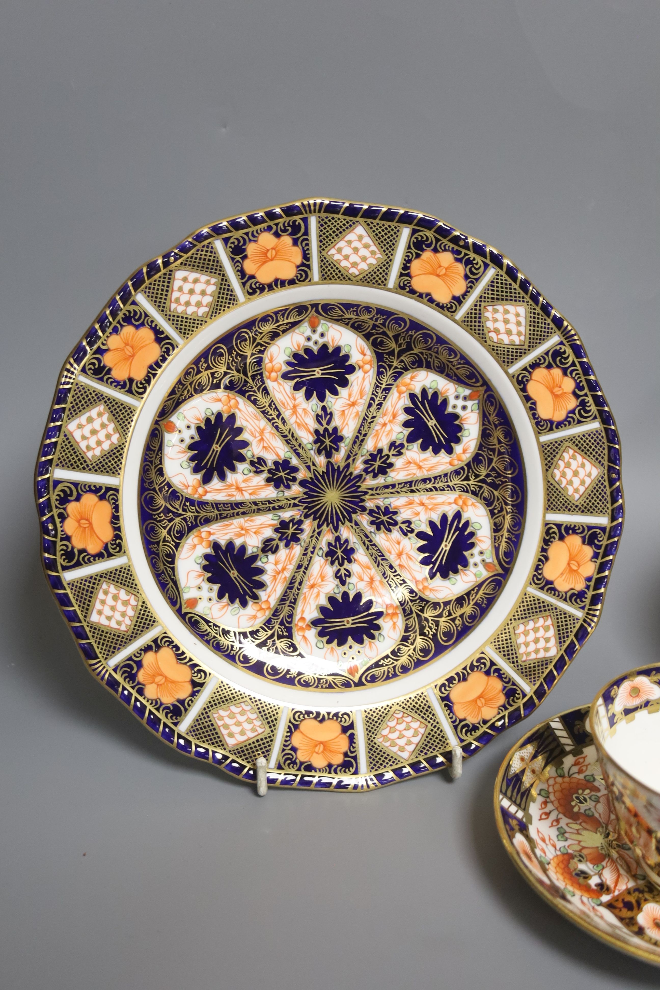 A Derby 1128 Imari pattern plate and Sampson Hancock Derby trio